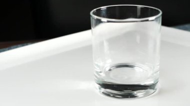  slow motion of pouting apple juice in a glass ,