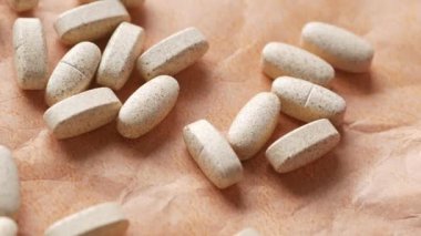  medical pills spilling on old paper ,