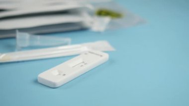 self covid-19 test kit on blue background .