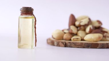  Brazilian nut oil in a container on table .