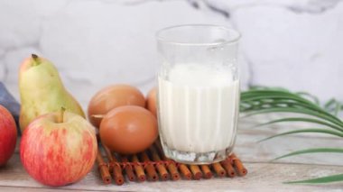 apple, milk and eggs for morning breakfast .