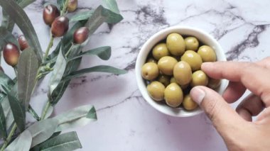hand pick fresh green olive ,