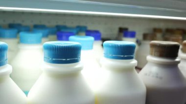 fresh milk in a plastic bottle in a shelf ,
