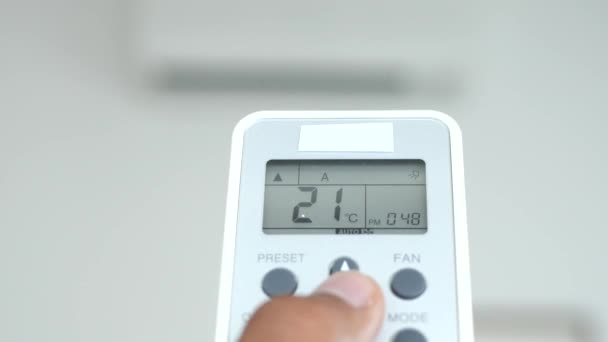 Women Hand Holding Air Condition Remote White Wall — Vídeo de Stock