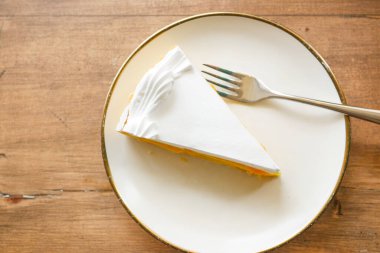  top view of slice of cheese cake in a plate on table ,