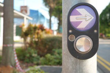 close up of crossing signal button in singapore .