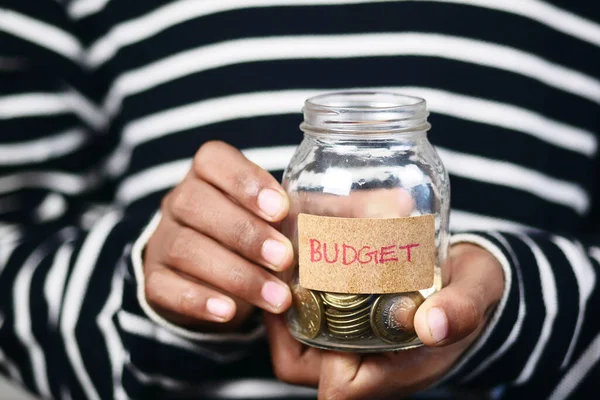 Men Holding Coin Jar Budget Text — Zdjęcie stockowe