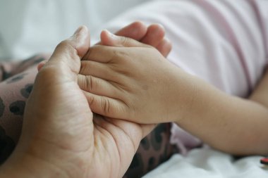 father holding child hand close up ,