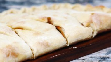  pizza calzone on a table .