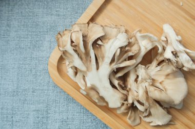 white fungus on wooden tray on table ,