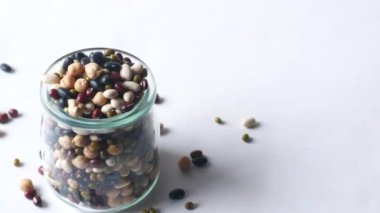 close up of mixed beans in glass jar ,
