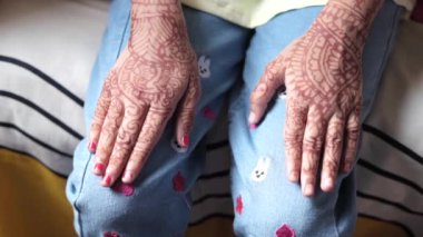 child girl with henna on hand ,