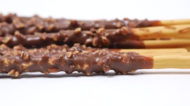 almond nut dark chocolate stick on table .