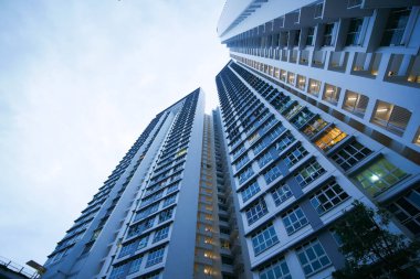 low angle view of signapore residential buildings against blue sky ,