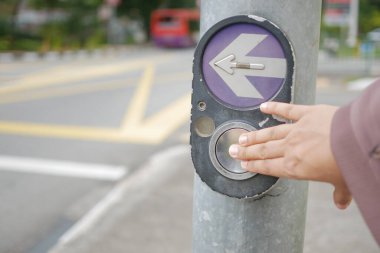 close up of crossing signal button in singapore .
