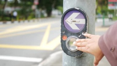 close up of crossing signal button in singapore .