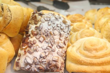  apple raisin bread on chopping board on table ,