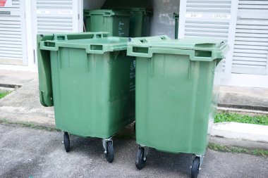 Bag with garbage and rubbish bin,