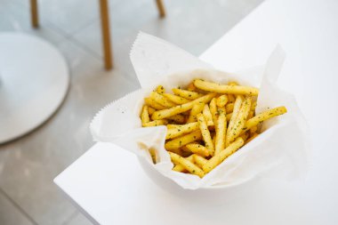 detail shot of French Fries on table .