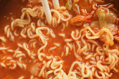 slow motion of eating spaghetti with a chopsticks.,