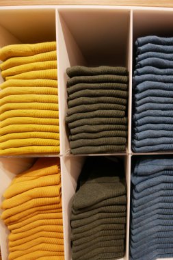 Close up of Colorful Shirts on shelf in a shop ,
