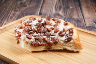  apple raisin bread on chopping board on table ,