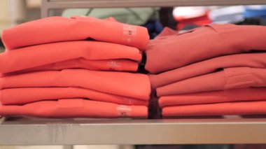 Close up of Colorful Shirts on shelf in a shop ,