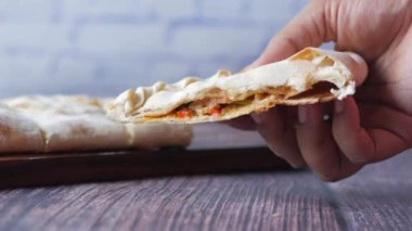  pizza calzone on a table .