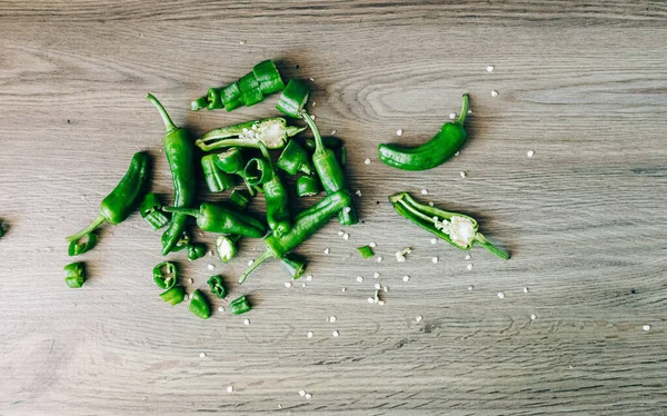 Green Chilli Peppers on Brown Wooden Surface Table Board