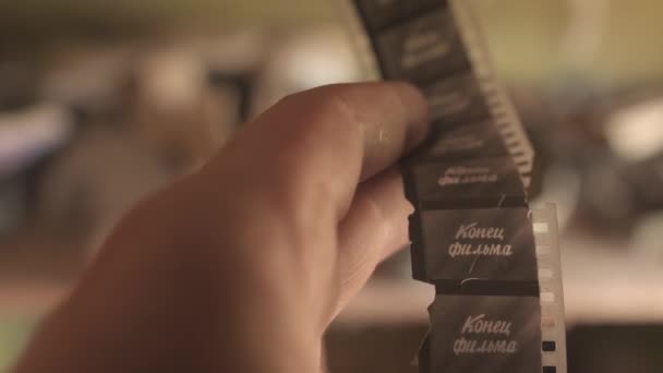 Hand Hold Old Soviet Film Tape Russian Cyrillic Language End — Stock Video