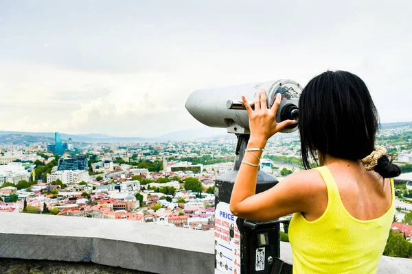Young Caucasian Woman Stand Viewpoint Enjoy Panorama Binoculars Georgia Capital — стокове фото