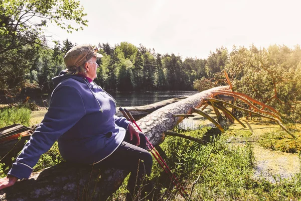 Elderly Woman Sit Tree Branch Lake Shore Enjoy Summer Day — Stockfoto