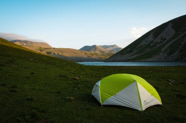 Green tent view panorama with Levanis lake in Georgia