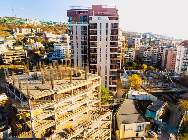 Aerial view real estate construction site with workers and panoramic view of property building houses