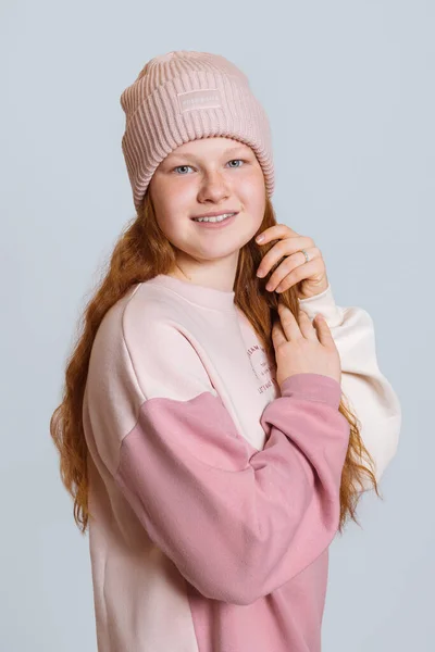 Girl Red Hair Sweater Hat Straightens Her Hair Smiles Waist — Stock Photo, Image