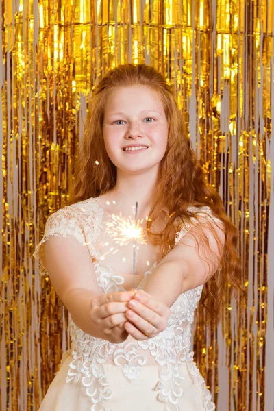 Young Girl Elegant Dress Holds Sparklers Golden Background — Stock Photo, Image