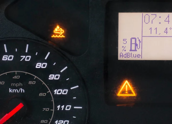 Close up of a truck display with low AdBlue indication warning — Stock Photo, Image