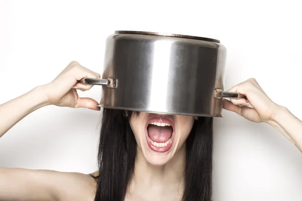 Stressed girl wearing a pot as hat — Stock Photo, Image