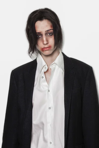 Beaten up girl wearing shirt and suit — Stock Photo, Image