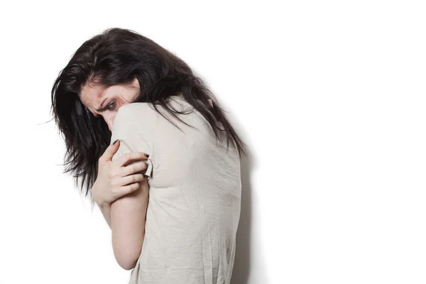 Beaten up girl trying to hide — Stock Photo, Image