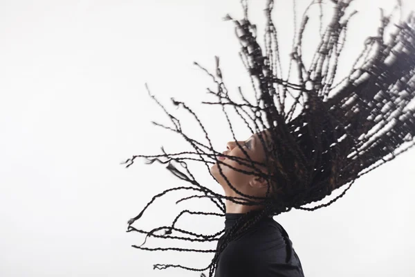 Girl throwing up her braids — Stock Photo, Image