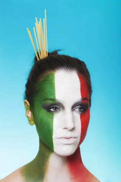 Italian woman with spaghetti in her hair — Stock Photo, Image