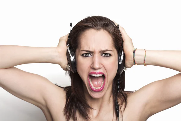 Girl listening to music and screaming — Stock Photo, Image