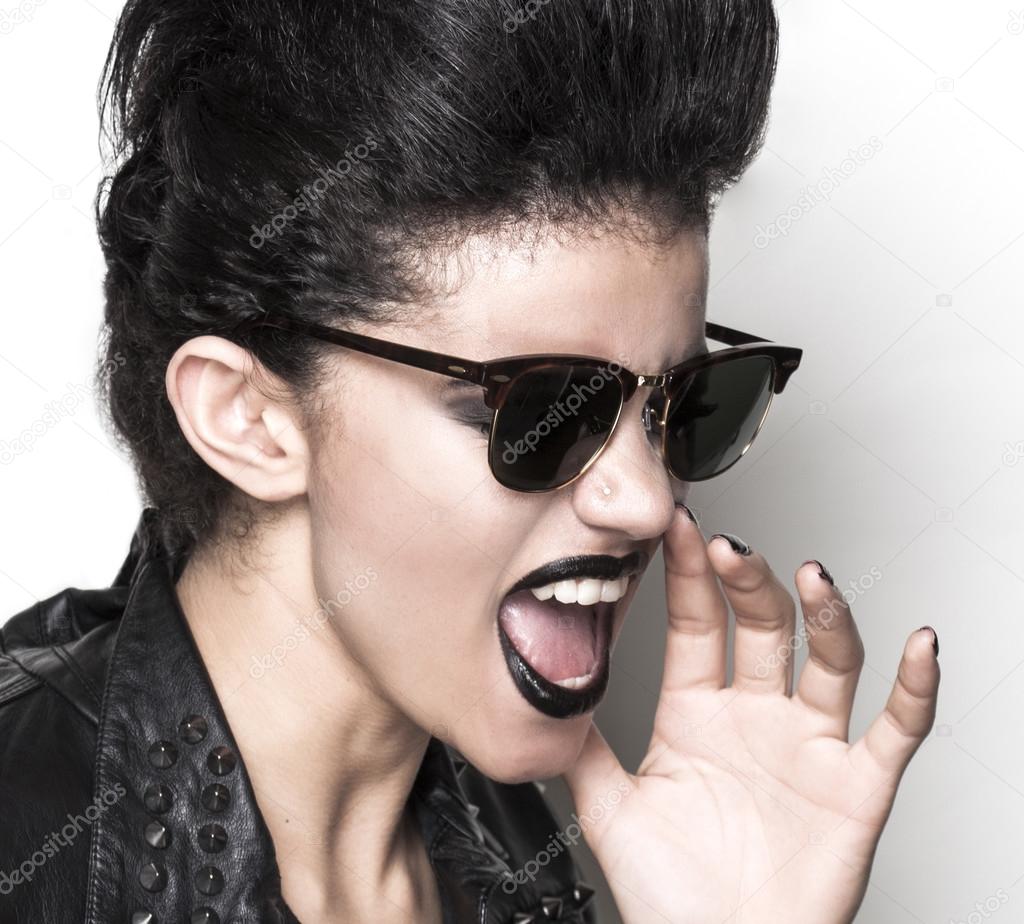 Rock girl wearing sunglasses half profile