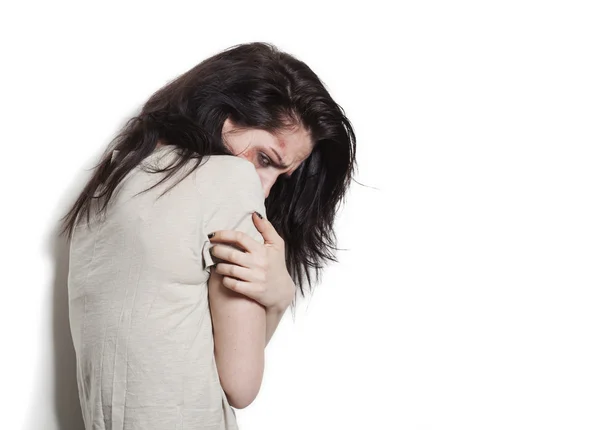 Beaten up girl trying to hide — Stock Photo, Image