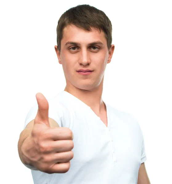 Young man shows thumb up gesture — Stock Photo, Image