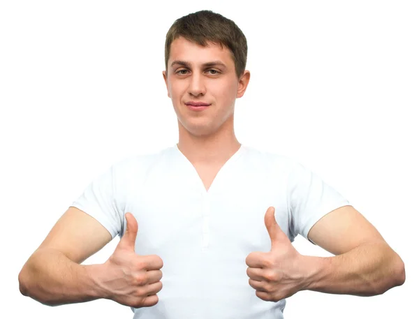 Happy smiling guy showing thumb up hand sign — Stock Photo, Image