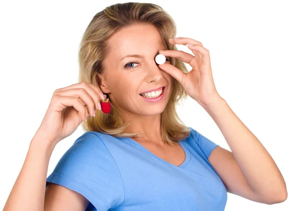 Woman holds tablet and raspberry — Stock Photo, Image