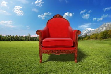 Red armchair in the desert clipart
