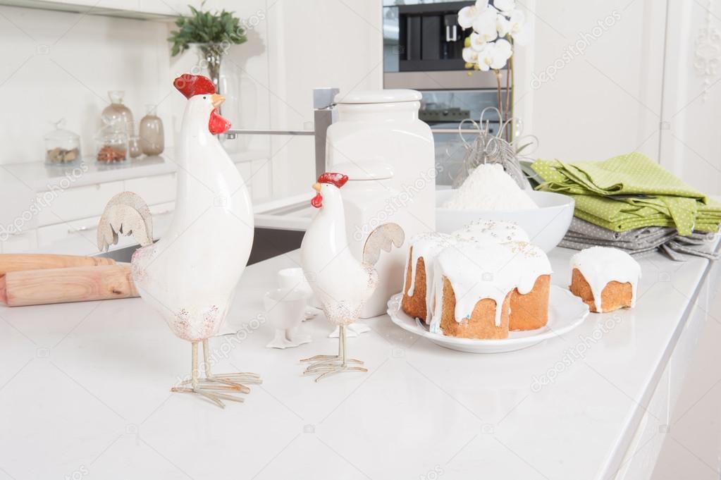 Easter cakes and cock are on kitchen